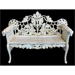 Coalbrookdale design - early 20th century cast iron oak leaf and acorn bench, white painted cast iron frame with slatted wooden seat, the pierced and shaped back decorated with scrolling oak branches and leafage, flanked by dog mask arm terminals over cabriole supports with paw feet 