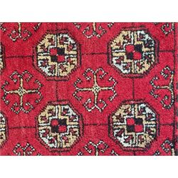 Afghan red ground Bokhara rug, decorated with four central Gul motifs, enclosed by wide geometric guard bands (191cm x 104cm); together with another similar (120cm x 79cm)