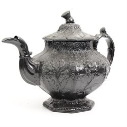 Six early 19th century and later black basalt tea and coffee pots, mostly with relief or engine-turned bodies, including a Cyples 'Egyptian black’ engine turned coffee pot on pedestal foot, another with shamrock, thistle and rose moulded decoration and four others 