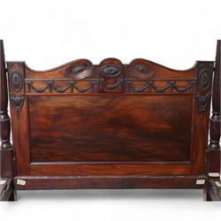 19th century and later Hepplewhite design mahogany four poster double bed, urn finials atop reeded and turned pilasters, head and footboard decorated with carved and moulded floral festoons and acanthus rosettes, shaped apron over shaped supports and square feet