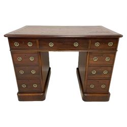 Victorian mahogany twin pedestal desk, moulded rectangular top with rounded corners and inset leather writing surface, fitted with nine drawers, on moulded plinth base