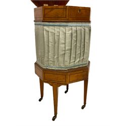 19th century satinwood sewing or work table, octagonal form enclosed by hinged lid, the interior with removal section with lidded compartments concealing storage well, upholstered in pleated silk, inlaid with ebony stringing, on square tapering supports with brass castors 