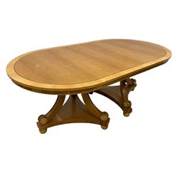 Contemporary Regency design oak and maple extending dining table - two D-ends with maple cross banding, on three curved pillar supports decorated with turned roundels, concaved triangular platform on turned bun feet, with additional leaf