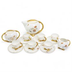 Polish Art Deco style tea service by Cmielow, of globular form with gilt handles and angular splayed feet, comprising teapot, sucrier, milk jug and six cups and saucers, post 1930 printed mark beneath