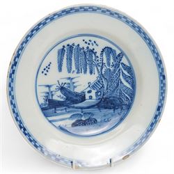 18th century Delft plate decorated with a Chinoiserie landscape, within a chequered border, D23cm