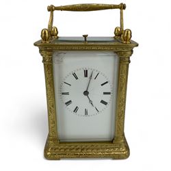 Auguste of Paris - mid-19th century carriage clock in a foliate engraved case with acorn finials and conforming carrying handle, white enamel dial with makers name, Roman numerals, minute track and fine matching steel moon hands,  engraved rear door revealing a twin train going barrel movement striking the hours and half hours on a bell, with the original jewelled lever platform escapement and repeat function, back plate stamped Auguste-Paris, 