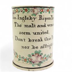 Early 19th century Sunderland creamware frog mug, hand painted with verse 'John Ingleby Ripon Yorkshire, Tho' malt and venom, seem united; Don't break this Pot, nor be affrighted', within a painted wreath and black borders, H14cm 