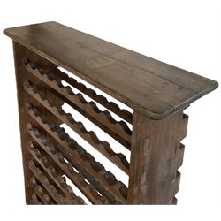 Large reclaimed oak eight tier wine rack, rectangular top over eight racks each with ten bottle divisions, on end supports