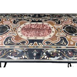 20th century Florentine design pietra dura specimen table, the rectangular top inlaid with a variety of stone and marble, central rouge marble medallion surrounded by scrolls, flowerheads and small bird motifs, the border decorated with scrolling foliage, raised upon a wrought metal base, scrolled end supports united by stretcher
