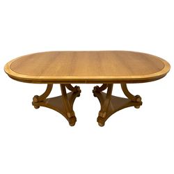 Contemporary Regency design oak and maple extending dining table - two D-ends with maple cross banding, on three curved pillar supports decorated with turned roundels, concaved triangular platform on turned bun feet, with additional leaf