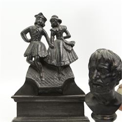 Spelter figure of a huntsman, bronzed figure of a Hussar, iron doorstop and two metal busts