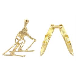 Gold pair of skis pendant and a gold skier pendant, both 14ct