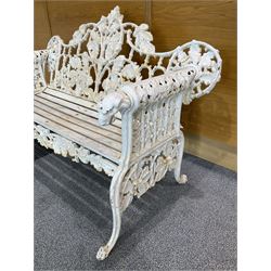 Coalbrookdale design - early 20th century cast iron oak leaf and acorn bench, white painted cast iron frame with slatted wooden seat, the pierced and shaped back decorated with scrolling oak branches and leafage, flanked by dog mask arm terminals over cabriole supports with paw feet 