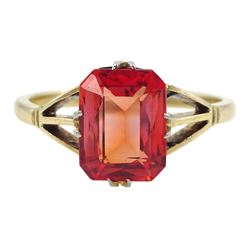 9ct gold single stone emerald cut red-orange sapphire ring, with forked shoulders