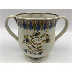 18th century and later porcelain comprising two handled creamware loving cup with floral decoration 12cm Worcester fluted tea cup and saucer decorated in blue and white with floral sprays together with later Chinese famille rose tea bowl and saucer  (3)