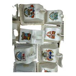 Collection of crested ware miniature cheese dishes and covers, including one by Goss, in one box