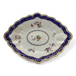 18th century Derby fluted lozenge shaped dish, in the manner of Edward Withers, painted with flower sprays within a blue and gilt leafy chain border, crown over D in blue, incised N, L26cm 