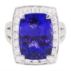 18ct white gold tanzanite and round brilliant cut diamond cluster ring, with diamond set shoulders, hallmarked, tanzanite approx 9.25 carat, total diamond weight approx 1.30 carat