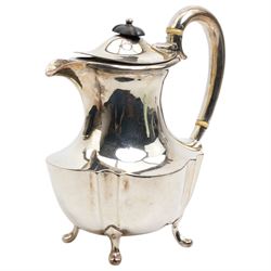 Silver oval teapot with ebonised lift, ivory insulators, loop handle and raised on four shaped supports and matching hot water jug Sheffield 1922/3 Maker Fenton Bros. Ltd. This item has been registered for sale under Section 10 of the APHA Ivory Act