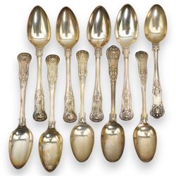 A matched set of 19th century silver Kings pattern cutlery comprising six table spoons, ten table forks, twelve dessert spoons, fish slice, pair of sauce ladles, ten teaspoons, six fish knives, seven silver handled knives, two salt spoons  and fifteen dessert forks, various dates and makers 