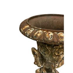 Pair of Victorian cast iron garden urns, egg and dart moulded rim, the body cast with acanthus leaf scrolls and gadrooned underbelly, mounted by lion bask handles, circular foot terminating to square base