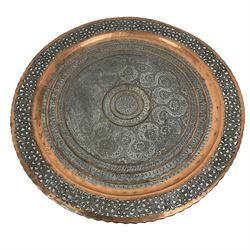 20th century Benares table, circular pierced copper tray top decorated with concentric floral pattern, on folding wooden base