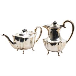 Silver oval teapot with ebonised lift, ivory insulators, loop handle and raised on four shaped supports and matching hot water jug Sheffield 1922/3 Maker Fenton Bros. Ltd. This item has been registered for sale under Section 10 of the APHA Ivory Act