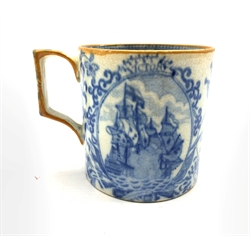 Early 19th Century transfer printed commemorative pottery 'Nelson' mug, possibly Swansea, printed in blue and white with portrait of Nelson, HMS Victory etc with angular yellow lined handle and rim H9cm