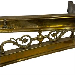 Early 20th century brass adjustable fire fender, scrolling foliate decoration with raised gallery, max aperture 146cm; together with three others (4)