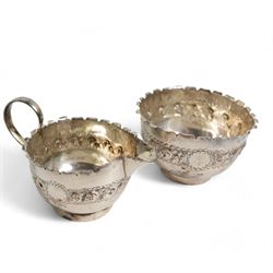 Late Victorian silver sugar bowl and matching cream jug with crimped rims Birmingham 1900, silver three piece condiment set, silver pepperette and two silver saucer dishes 