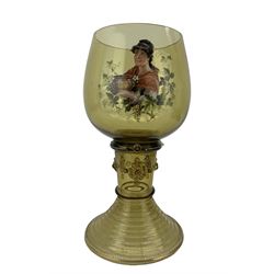 Very large late 19th century German glass roemer, typical form with enamelled prunts, the bowl enamelled depicting a lady holding a bowl of punch, within a border of fruiting vines, numbered '9384' to rim, H31.5cm