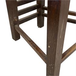 In the manner of Charles Rennie Mackintosh - contemporary pair of oak high ladder back hall chairs, on square supports united by stretchers 