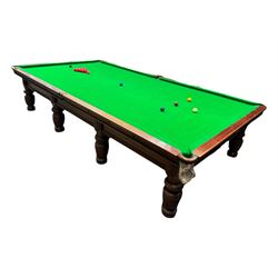 Riley - early 20th century full-sized mahogany billiards or snooker table, on eight turned baluster supports, with cue rack, scoreboard, balls and various cues 