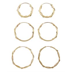 Three pairs of 9ct gold hoop earrings, with rope twist decoration