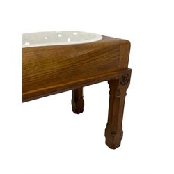 Late Victorian oak bidet stool, rectangular form with lid, shaped ceramic basin, on square chamfered supports carved with flowerhead roundels 