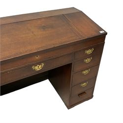 George III oak kneehole clerk's desk, hinged sloping lid enclosing six correspondence drawers and pigeonholes, fitted with central frieze drawer flanked by ten graduating drawers 