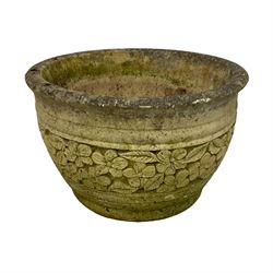 Circular cast stone garden planter decorated with flower head band (D44cm, H28cm); smaller planter (D34cm, H27cm); composite stone rusticated bird bath, octagonal top on tapering pedestal (W41cm, H65cm) (3)