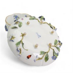 Pair of Meissen tea cups and saucers, encrusted with forget-me-nots and decorated with flowers and insects, raised on peg feet, H8cm and an early 20th century Meissen teapot, decorated with courting couples, H12cm (3)