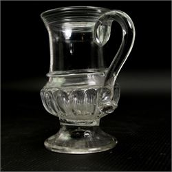 Glass coin jug, with ribbed body and inset with a George II silver 1d penny, H11cm; an 18th century Shrub decanter, circa 1785, H15.5cm; together with an 18th century English green wine bottle, H29.5cm (3)