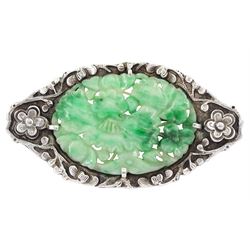 Early 20th century Chinese export silver and jade brooch, oval jade plaque pierced and carved depicting flowers, within a prunus frame, stamped Sterling