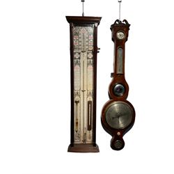 An early 20th century Fitzroy mercury barometer and a late 19th century wheel barometer. Fitzroy barometer with full size charts, storm glass and mercury thermometer, case fitted with adjustable verniers. Five glass mercury wheel barometer in a mahogany case with hygrometer, mercury thermometer, butlers mirror, 8