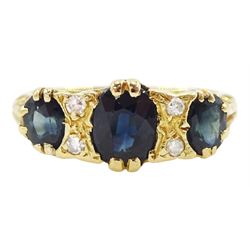 18ct gold three stone oval cut sapphire and four stone round brilliant cut diamond ring, stamped