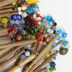 Collection of turned wooden lace maker's bobbins, including 19th century and later examples, mostly with glass spangles and turned shafts (80 approx)