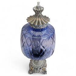 Vintage pierced brass table lamp in the form of an oil lamp, with blue glass shade, H64cm 