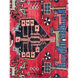 Persian crimson ground runner, the field decorated with stylised tree and animal motifs, indigo ground border decorated with alternating stylised flowerhead and bird motifs 