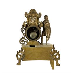 French - late 19th century 8-day mantle clock with two matching five light candelabra, gilt spelter case with alabaster panels and plinth, drum movement and standing figure from classical antiquity, enamel dial with Roman numerals, minute markers and steel hands, with a twin train countwheel striking movement striking the hours and half-hours on a bell. With pendulum. 