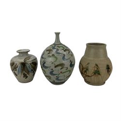 Paul Muchan (b.1948), studio pottery vase, glazed in tones of blue, green and black on a white ground, impressed marks and paper label, H7cm; Peter Clough (b.1944) studio pottery vase, decorated with flowers, inpressed mark, H11cm; and Adrian Lewis-Evans (1927-2021), studio potter vase, decorated with willow trees, impressed marks, H14cm (3)