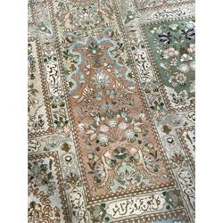 Persian Bakhtiari camel ground garden carpet, the field decorated with square panels containing stylised tree of life and Mirab motifs with birds and animals, with further floral and palmette patterns, the guarded border with repeating bouquets and posies of stylised plant motifs