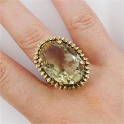 9ct gold oval cut smoky quartz ring, in a fancy textured claw setting, London 1977