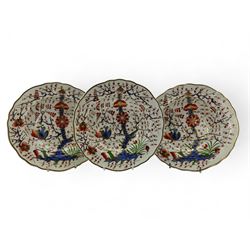 Three early 19th century Derby porcelain soup bowls decorated in the 'Tree of Life' pattern, in the imari pallette, within shaped gilt borders, D26cm (3)